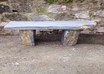 <p>Grey/blue slate bench, aprox 110cm long by 40cm wide. Rich bronze veining</p>